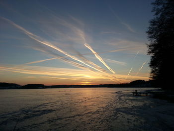 Scenic view of beach against sky during sunset