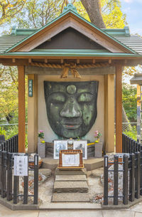 Statue outside temple against building