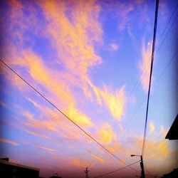 Low angle view of cloudy sky at sunset