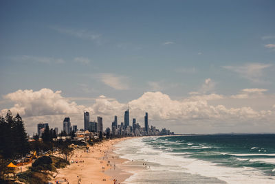 Panoramic view of sea and city against sky