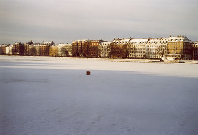Buildings against sky in city during winter