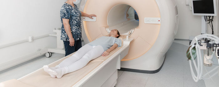 High angle view of woman standing in bathroom