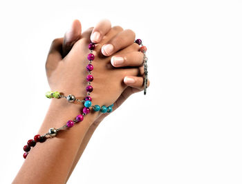 Close-up of woman hand over white background