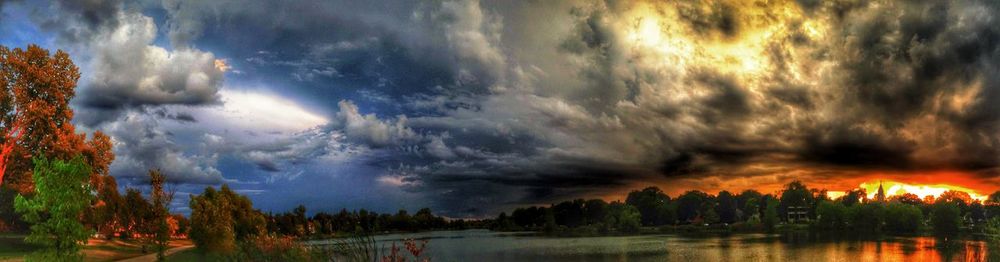 Scenic view of lake against cloudy sky