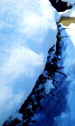 Scenic view of snow covered mountain against sky