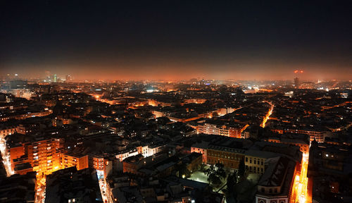 High angle view of city buildings at night