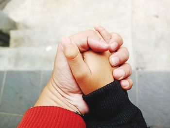 Close-up of hands holding baby hand