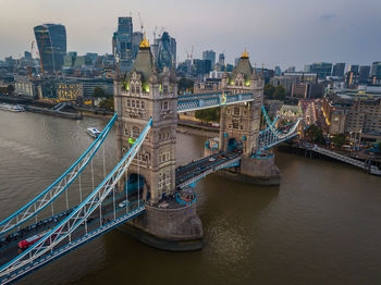 Aerial view of bridge over river in city