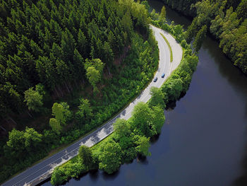 High angle view of road by river against sky