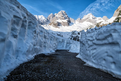 Scenic view of snowcapped mountains against sky