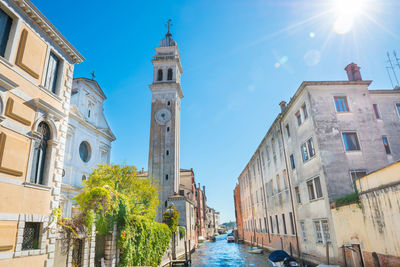 View of campanile of church san giorgio dei greci and canal on a sunny day. venice, italy