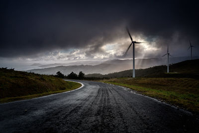 Road amidst landscape against sky