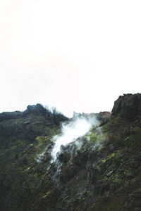 Scenic view of waterfall against clear sky