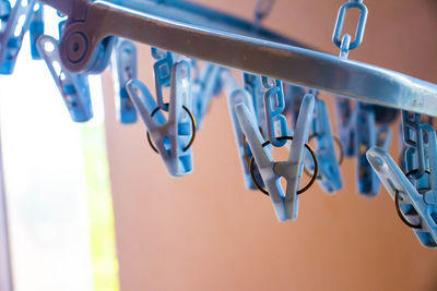 Close-up of water drops hanging on clothesline