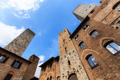 Low angle view of historic building against blue sky