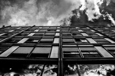 Low angle view of building against cloudy sky