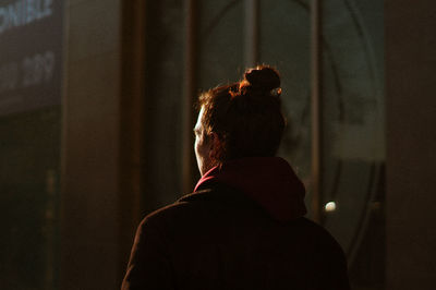 Rear view of man looking at home