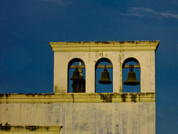 Low angle view of building against blue sky