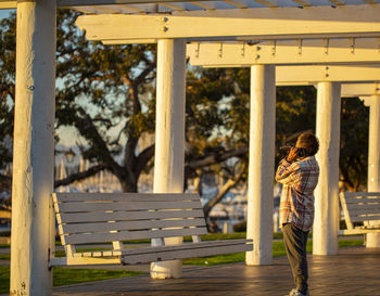 Man standing by railing