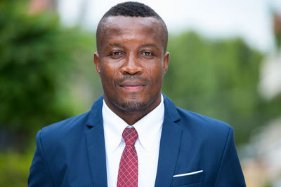 Portrait of businessman standing outdoors