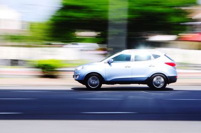 Blurred motion of car on road