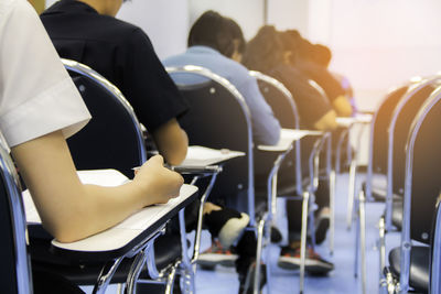 University students taking test in exam hall