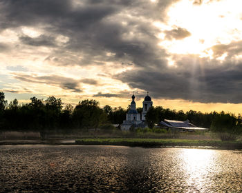 Scenic view of lake against sky during sunset