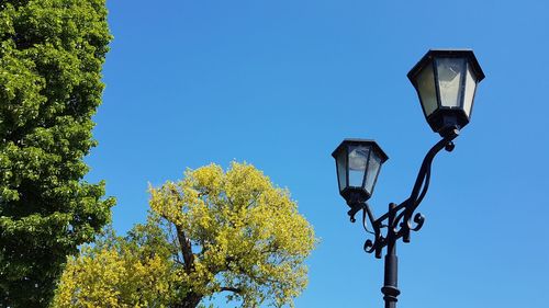 Low angle view of street light against sky