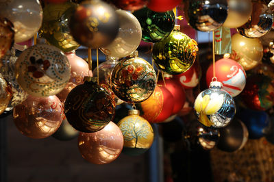 Close-up of christmas decorations hanging at market stall