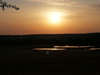 Scenic view of silhouette landscape against sky during sunset