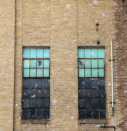 Full frame shot of window on wall of abandoned building