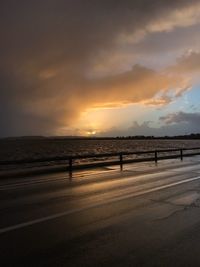 Scenic view of beach against sky during sunset