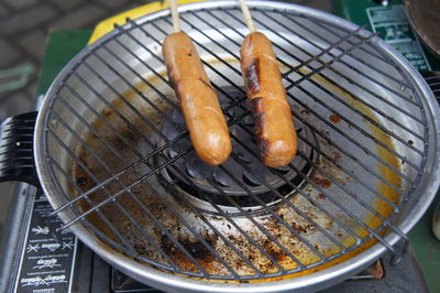 High angle view of meat on barbecue grill