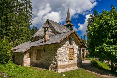 Little chapel on braies lake pragser wildsee, italian dolomites