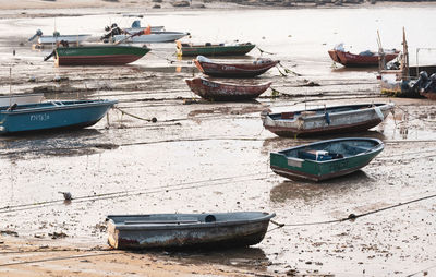 Boats moored on shore