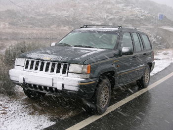 Close-up of damaged car in winter