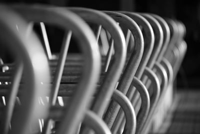 Close-up of bike-rack b/w lit from side