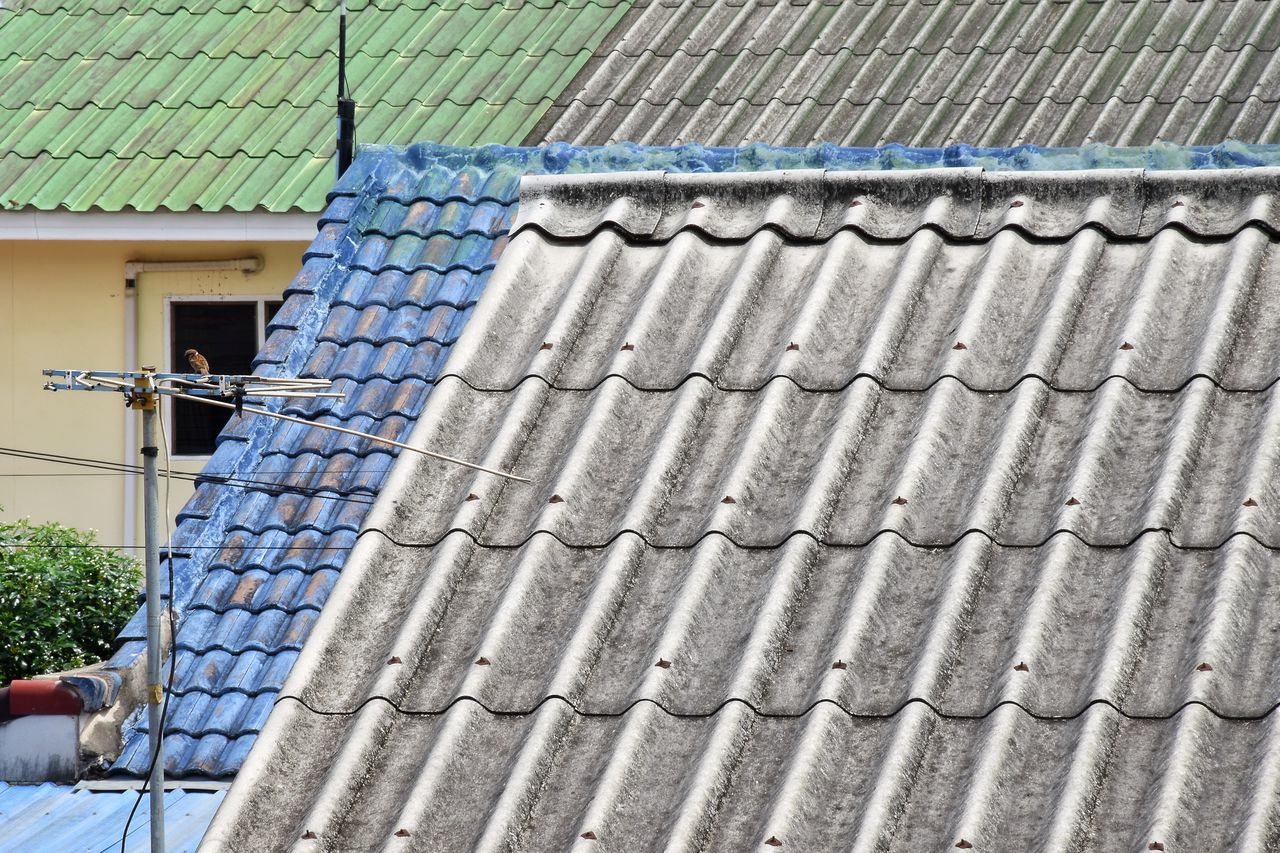 LOW ANGLE VIEW OF ROOF TILES ON BUILDING