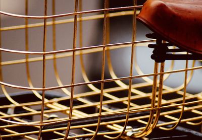 Close-up of metal grate in cage