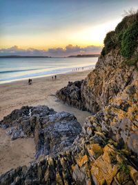 Scenic view of sea against sky at sunset