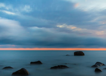 Scenic view of sea against dramatic sky