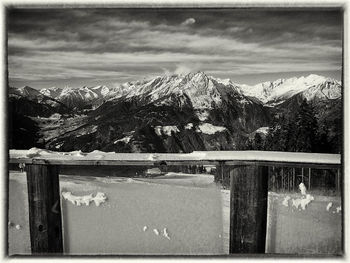 Scenic view of mountains against cloudy sky