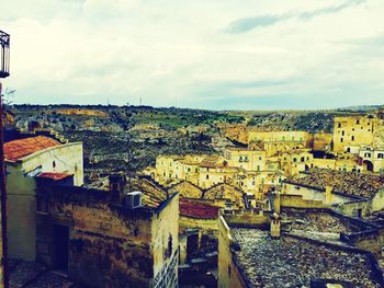 Houses in city against sky