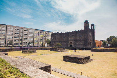 Old building against cloudy sky