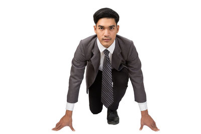 Portrait of young man against white background