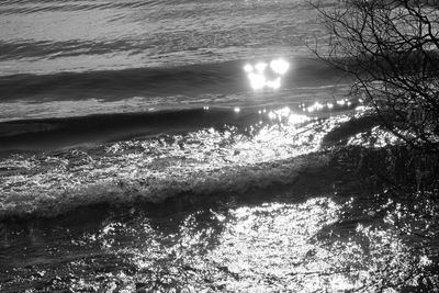 High angle view of water flowing over sea