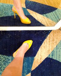 Low section of person standing on road