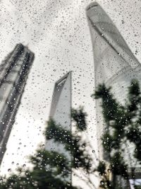 Close-up of wet glass window in rainy season