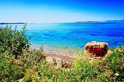 Close-up of sea against clear blue sky