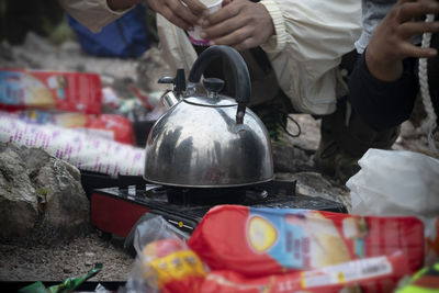 People preparing food at market stall